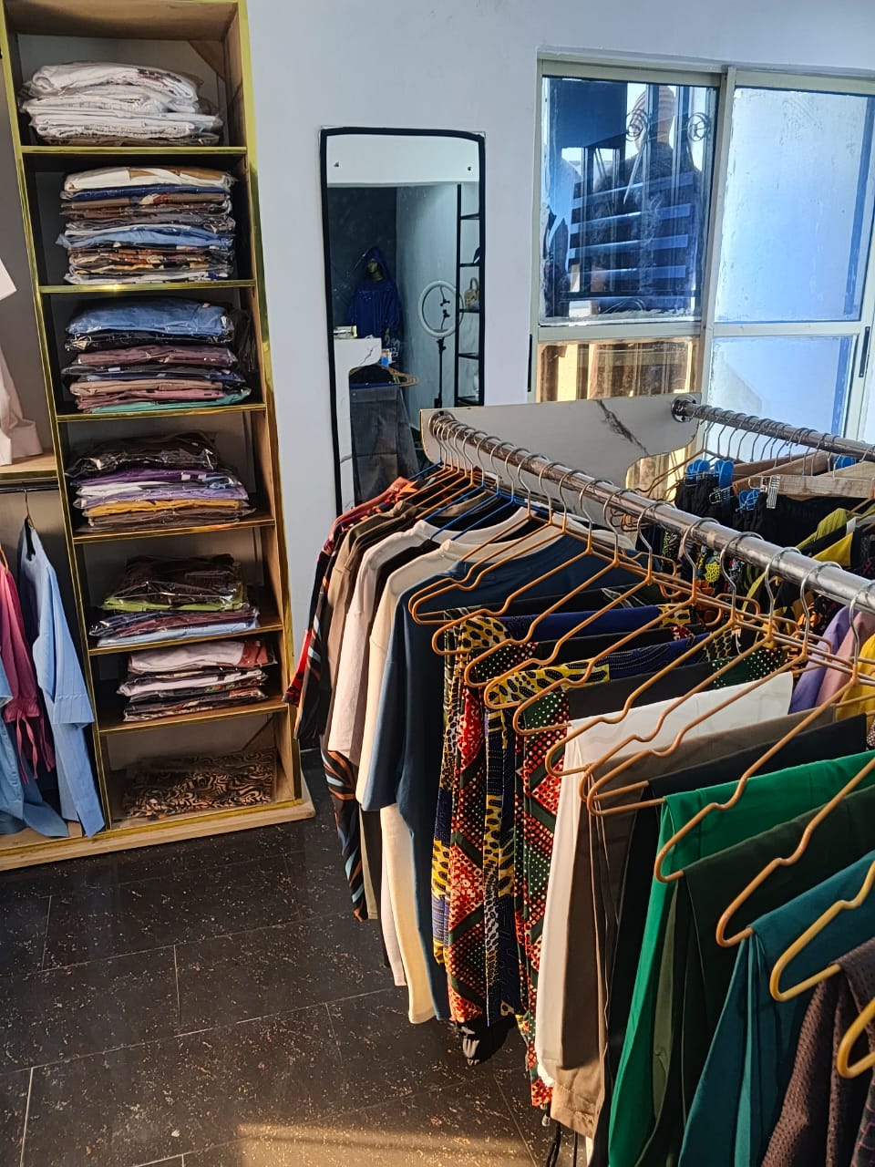 Inside Remmy's Prestige Fashion boutique — caps and luxury details